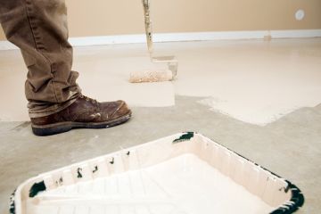 Painter painting garage floor in Modoc