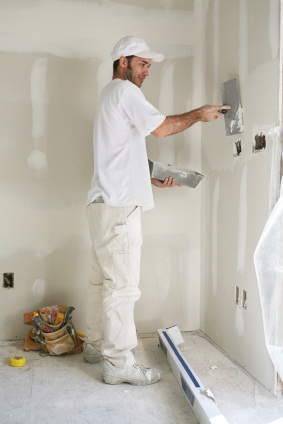 Drywall repair being performed by an experienced G & M Painting, LLC drywall technician.